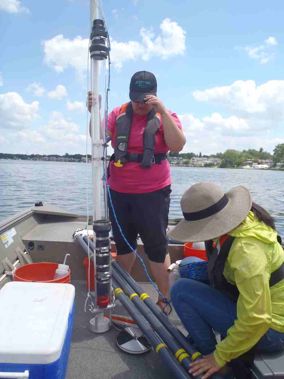 Preparing to collect water column samples in Spring Lake.